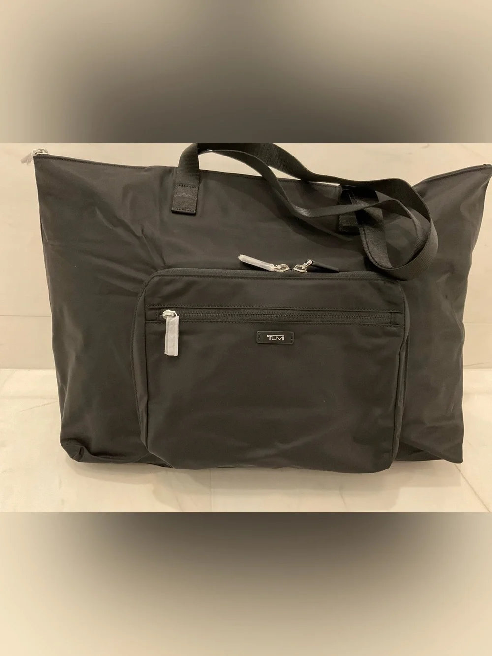 Tumi up sale
